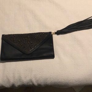 Carlos Santana black leather clutch
